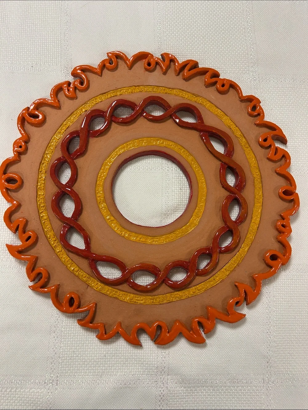 Handcrafted Sunburst Ceramic Wall Accent in Orange and Terracotta